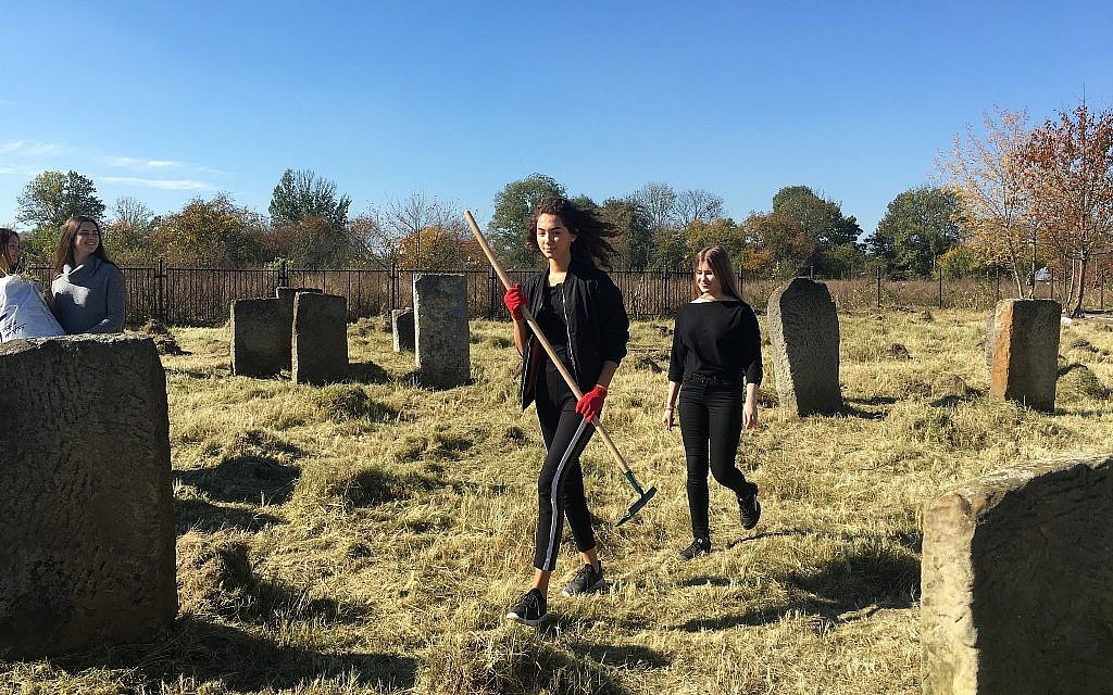 Students at the local high school participated in the Day of Action Clean-Up at the Kalush Jewish Cemetery. (Marla Raucher Osborn/ Rohaytn Jewish Heritage)Marla Raucher Osborn/ Rohaytn Jewish Heritage)
