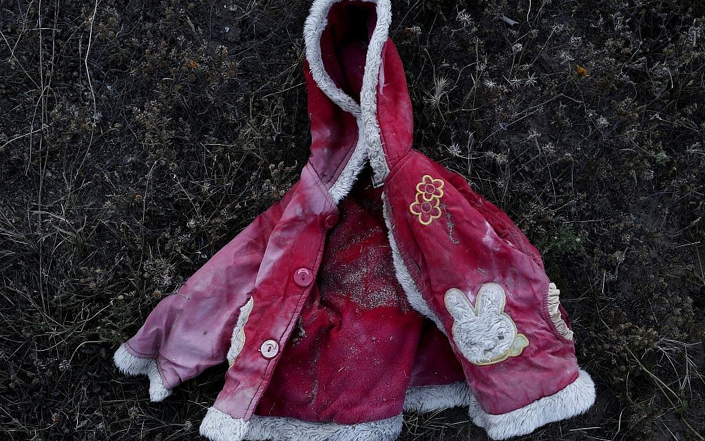 This April 15, 2018 photo shows a migrant child's jacket which was retrieved by artist Mohsen Lahzib, who tries to create beauty out of sorrow, at his space in the southern port town of Zarzis, Tunisia. (AP Photo/Nariman El-Mofty)