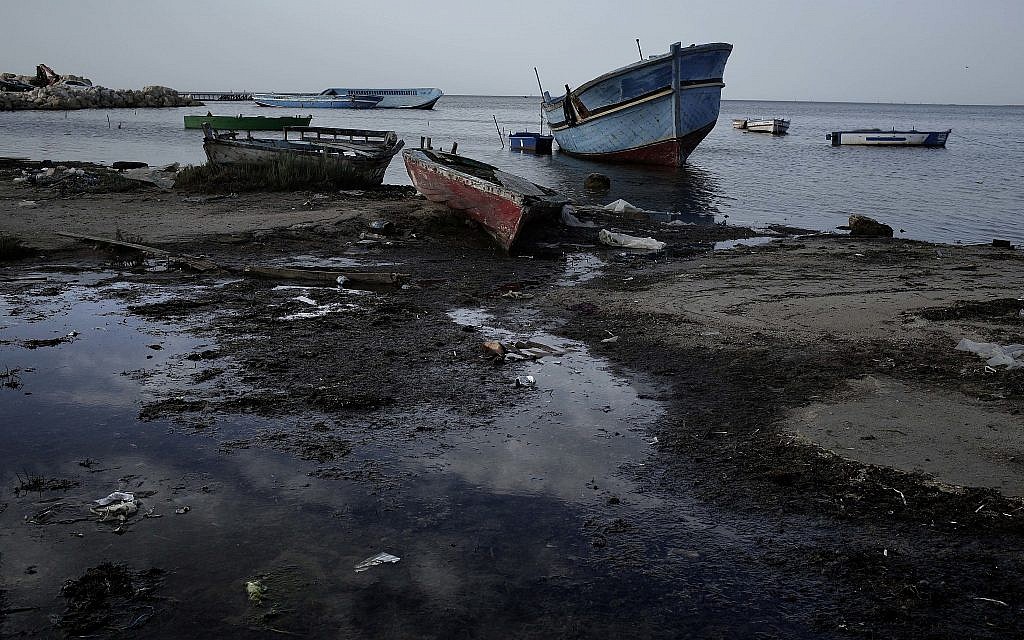 This April 16, 2018 photo shows wrecked boats that have carried migrants at the coastal city Monastir, Tunisia. (AP Photo/Nariman El-Mofty)