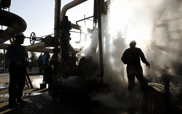 In this photo from November 17, 2007, a worker repairs a part of a unit of the Tehran oil refinery, in Tehran, Iran. (AP Photo/Vahid Salemi, File) In this photo from November 17, 2007, a worker repairs a part of a unit of the Tehran oil refinery, in Tehran, Iran. (AP Photo/Vahid Salemi, File)
