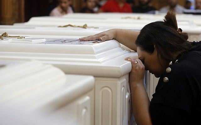 A relative of a slain Christian grieves during funeral service at Church of Great Martyr Prince Tadros, in Minya, Egypt on Nov. 3, 2018. (AP Photo/Amr Nabil) A relative of a slain Christian grieves during funeral service at Church of Great Martyr Prince Tadros, in Minya, Egypt on Nov. 3, 2018. (AP Photo/Amr Nabil)