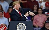 President Donald Trump looks at his watch near the end of a campaign rally Monday, November 5, 2018, in Cape Girardeau, Missouri. (AP Photo/Jeff Roberson)