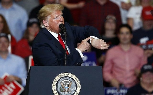 President Donald Trump looks at his watch near the end of a campaign rally Monday, November 5, 2018, in Cape Girardeau, Missouri. (AP Photo/Jeff Roberson) President Donald Trump looks at his watch near the end of a campaign rally Monday, November 5, 2018, in Cape Girardeau, Missouri. (AP Photo/Jeff Roberson)