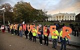 Protesters gather in front of the White House in Washington, Thursday, November 8, 2018, as part of a nationwide "Protect Mueller" campaign demanding that acting US Attorney General Matthew Whitaker recuse himself from overseeing the ongoing special counsel investigation. (AP Photo/Manuel Balce Ceneta)