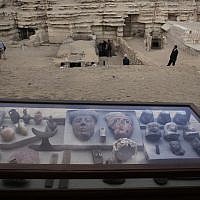 Artifacts on display in their glass case in front of newly discovered tombs, at an ancient necropolis near Egypt's famed pyramids in Saqqara, Giza, Egypt, November 10, 2018. (Nariman El-Mofty/AP)
