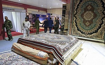 In this Saturday, November 10, 2018 photo, visitors tour the Iranian wing of the Baghdad International Fair, in Baghdad, Iraq. (AP Photo/Karim Kadim)