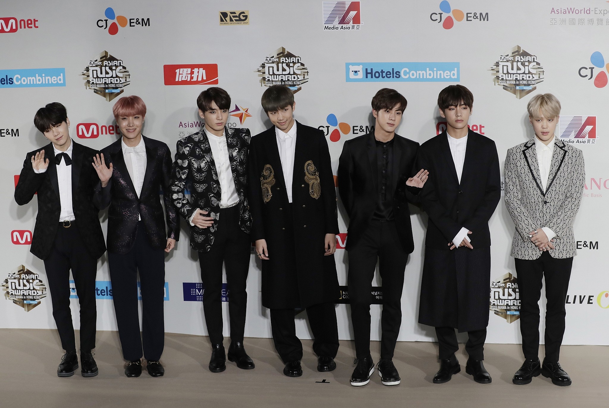 K-Pop band BTS apologizes for member's A-bomb shirt, Nazi emblem