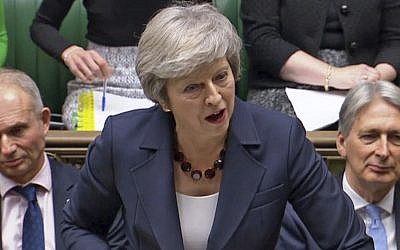 In this grab taken from video, Britain's Prime Minister Theresa May speaks during Prime Minister's Questions in the House of Commons, London, on November 14, 2018. (PA via AP)