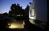 The Facebook "like" symbol is illuminated on a sign outside the company's headquarters in Menlo Park, California, June 7, 2013. (AP Photo/Marcio Jose Sanchez, File)
