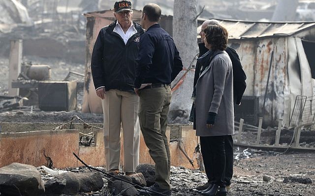 US President Donald Trump talks to FEMA Administrator Brock Long as he tours Paradise, California, local governor Jerry Brown and Paradise Mayor Jody Jones during a visit to a neighborhood impacted by the wildfires, November 17, 2018. (AP Photo/Evan Vucci) US President Donald Trump talks to FEMA Administrator Brock Long as he tours Paradise, California, local governor Jerry Brown and Paradise Mayor Jody Jones during a visit to a neighborhood impacted by the wildfires, November 17, 2018. (AP Photo/Evan Vucci)