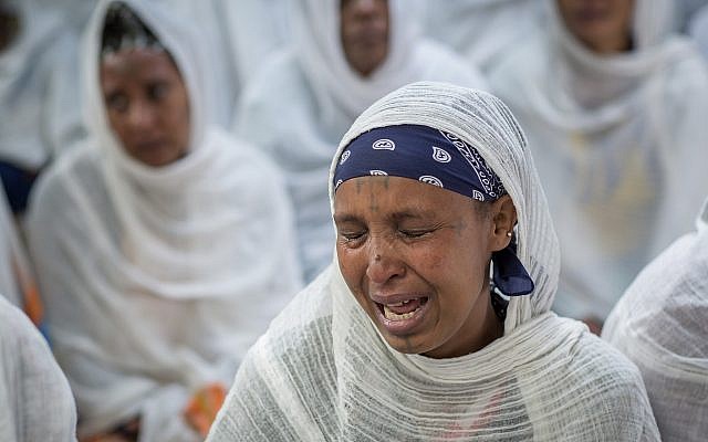 Members of Ethiopia's Jewish community protest the Israeli government's decision not to allow all of them to emigrate, at the synagogue in Addis Ababa, Ethiopia, on November 19, 2018. (AP Photo/Mulugeta Ayene) Members of Ethiopia's Jewish community protest the Israeli government's decision not to allow all of them to emigrate, at the synagogue in Addis Ababa, Ethiopia, on November 19, 2018. (AP Photo/Mulugeta Ayene)
