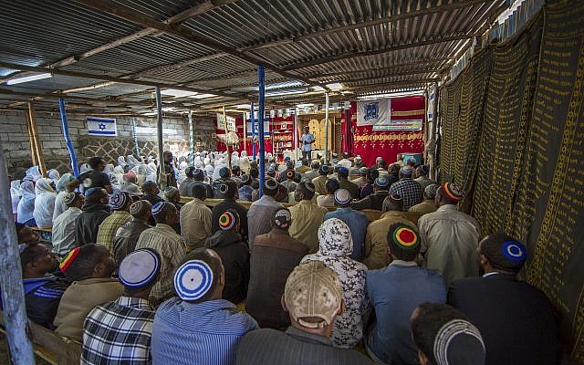 Illustrative: Members of Ethiopia's Jewish community protest the Israeli government's decision not to allow all of them to emigrate at the synagogue in Addis Ababa, Ethiopia Monday, November 19, 2018. (AP Photo/Mulugeta Ayene) Illustrative: Members of Ethiopia's Jewish community protest the Israeli government's decision not to allow all of them to emigrate at the synagogue in Addis Ababa, Ethiopia Monday, November 19, 2018. (AP Photo/Mulugeta Ayene)