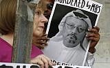 People hold signs during a protest at the Embassy of Saudi Arabia in the United States about the disappearance of Saudi journalist Jamal Khashoggi, in Washington, October 10, 2018. (AP Photo/Jacquelyn Martin, File)