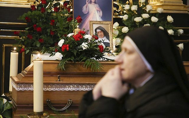 A nun prays beside the casket and photo of 110-year-old Roman Catholic Sister Cecylia Roszak, believed to be the world's oldest nun, and a rescuer of Jews during the Holocaust, during her funeral ceremonies at Church of Our Lady of the Snows the Dominican in Krakow, Poland, November 22, 2018. (AP Photo/Beata Zawrzel) A nun prays beside the casket and photo of 110-year-old Roman Catholic Sister Cecylia Roszak, believed to be the world's oldest nun, and a rescuer of Jews during the Holocaust, during her funeral ceremonies at Church of Our Lady of the Snows the Dominican in Krakow, Poland, November 22, 2018. (AP Photo/Beata Zawrzel)