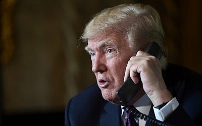 US President Donald Trump talks with troops via teleconference from his Mar-a-Lago estate in Palm Beach, Florida, November 22, 2018. (Susan Walsh/AP)
