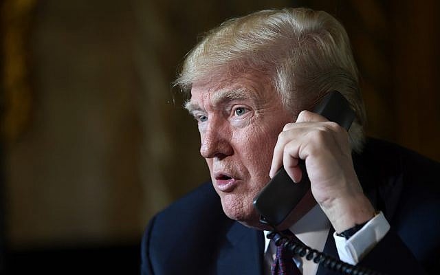 US President Donald Trump talks with troops via teleconference from his Mar-a-Lago estate in Palm Beach, Florida, November 22, 2018. (Susan Walsh/AP) US President Donald Trump talks with troops via teleconference from his Mar-a-Lago estate in Palm Beach, Florida, November 22, 2018. (Susan Walsh/AP)