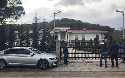 Paramilitary police officers stand at the entrance to a private villa in Yalova, Turkey, November 26, 2018. (DHA via AP)