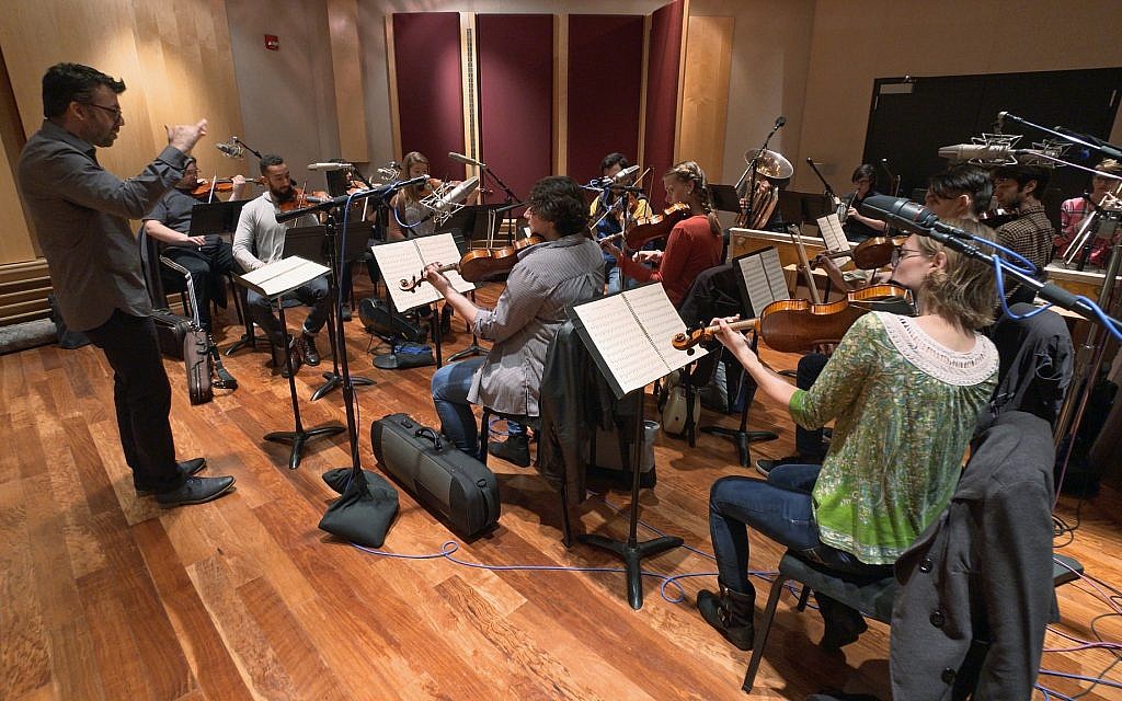 This Nov. 7, 2018, photo provided by the University of Michigan shows the Contemporary Directions Ensemble under the direction of Professor Oriol Sans in Ann Arbor recording "The Most Beautiful Time of Life" _ as it's translated from German to English (Christopher Boyes/University of Michigan via AP)