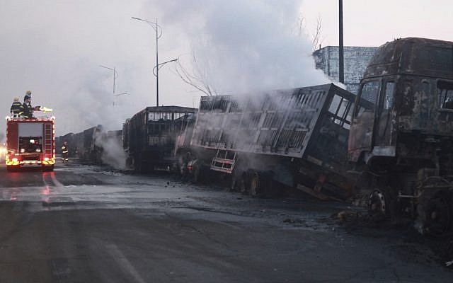 Firefighters try to extinguish burning vehicles in the aftermath of an explosion at a plant operated by the Hebei Shenghua Chemical Industry Co. Ltd, in Zhangjiakou city, northeastern China's Hebei province, November 28, 2018. (Xinhua via AP) Firefighters try to extinguish burning vehicles in the aftermath of an explosion at a plant operated by the Hebei Shenghua Chemical Industry Co. Ltd, in Zhangjiakou city, northeastern China's Hebei province, November 28, 2018. (Xinhua via AP)