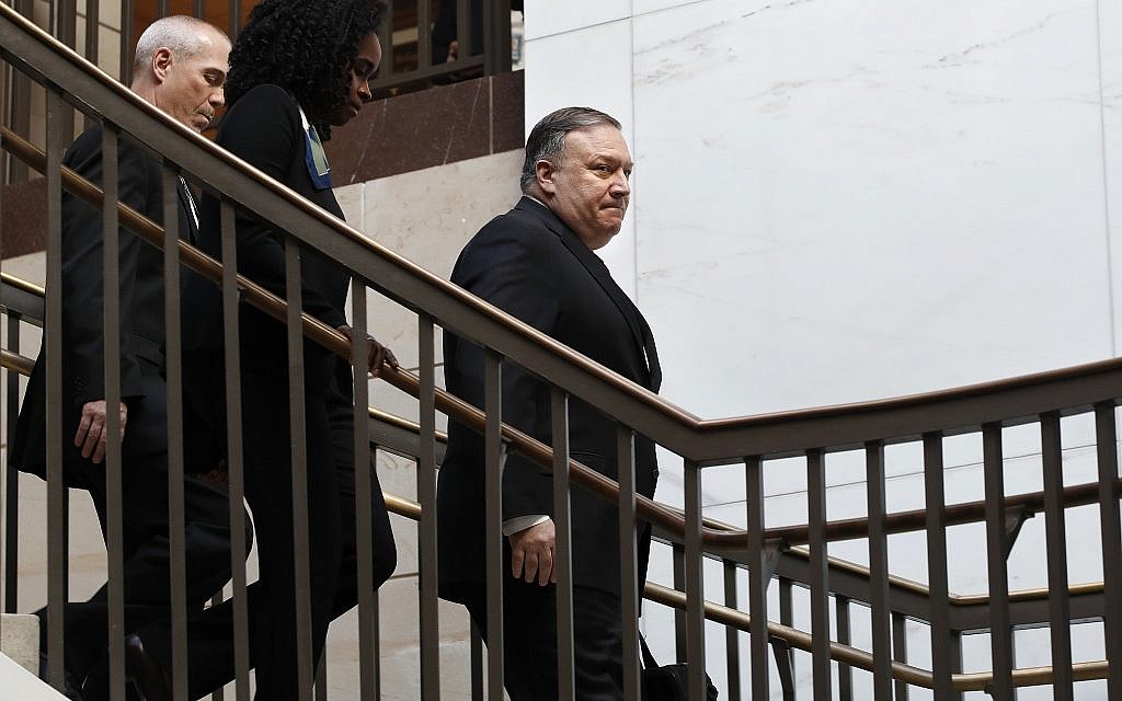 US Secretary of State Mike Pompeo, right, arrives for a closed door meeting with Senators about Saudi Arabia, November 28, 2018, on Capitol Hill in Washington. (AP Photo/Jacquelyn Martin)