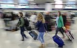 Illustrative: Passengers rush through New York's Penn Station to catch their train, Sunday, Nov. 27, 2016. (AP/Mark Lennihan)