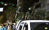 Members of the Izz ad-Din al-Qassam Brigades, Hamas's armed wing, marking Al-Quds Day in the Nuseirat refugee camp in the central Gaza Strip on Friday, June 23, 2017. (AP/Adel Hana)