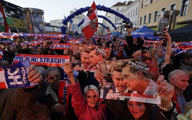 Supporters of the Austrian Freedom Party FPOe hold scarves and pictures of party leader Hans-Christian Strache and last year's presidential candidate Norbert Hofer during the final campaign rally of the party in Vienna, Austria, Friday, October 13, 2017. (AP/Matthias Schrader) Supporters of the Austrian Freedom Party FPOe hold scarves and pictures of party leader Hans-Christian Strache and last year's presidential candidate Norbert Hofer during the final campaign rally of the party in Vienna, Austria, Friday, October 13, 2017. (AP/Matthias Schrader)