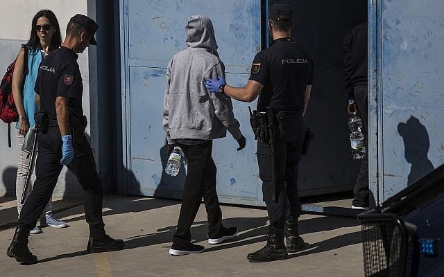Illustrative: Migrants are led into the Migrants Reception Center near Algerciras, Spain, Thursday, August 9, 2018. (AP/Javier Fergo) Illustrative: Migrants are led into the Migrants Reception Center near Algerciras, Spain, Thursday, August 9, 2018. (AP/Javier Fergo)