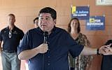 In this July 29, 2018, photo, Illinois Democratic governor candidate J.B. Pritzker talks with supporters in Geneva, Ill. New Illinois campaign reports show that Pritzker has pumped $146.5 million of his own money into his bid to unseat Republican Gov. Bruce Rauner. (AP Photo/Teresa Crawford)