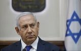 In this October 7, 2018 file photo, Prime Minister Benjamin Netanyahu attends the weekly cabinet meeting at his office in Jerusalem. (Abir Sultan/Pool via AP, File)