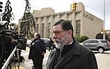 In this October 28, 2018 photo, Pittsburgh Mayor Bill Peduto walks in view of the Tree of Life Synagogue in Pittsburgh. (AP Photo/Matt Rourke)