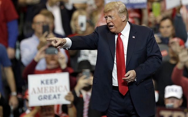 US President Donald Trump acknowledges supporters after speaking at a campaign rally on November 5, 2018, in Cleveland. (AP Photo/Tony Dejak)