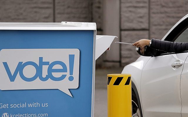 A driver drops a ballot into a drop box at the King County Elections office, November 5, 2018, in Renton, Wash. (Elaine Thompson/AP) A driver drops a ballot into a drop box at the King County Elections office, November 5, 2018, in Renton, Wash. (Elaine Thompson/AP)