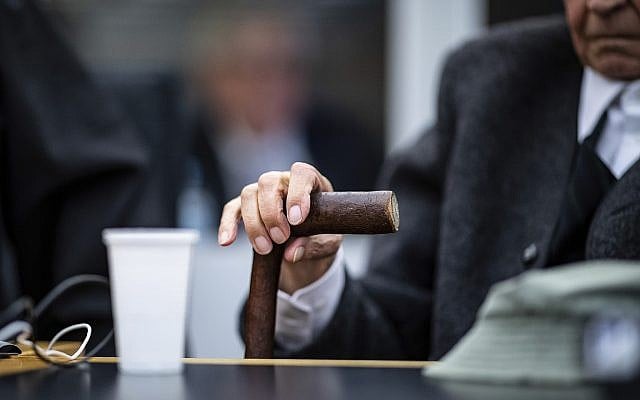 Johann Rehbogen, a 94-year-old former SS guard holds his walking stick at the beginning of a trial in Muenster, Germany, November 6, 2018. (Guido Kirchner/dpa via AP) Johann Rehbogen, a 94-year-old former SS guard holds his walking stick at the beginning of a trial in Muenster, Germany, November 6, 2018. (Guido Kirchner/dpa via AP)
