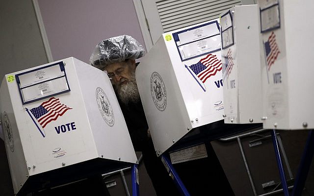 An Orthodox Jewish man fills out his ballot papers at a polling center on Tuesday, Nov. 6, 2018, in Brooklyn borough of New York. (AP Photo/Wong Maye-E) An Orthodox Jewish man fills out his ballot papers at a polling center on Tuesday, Nov. 6, 2018, in Brooklyn borough of New York. (AP Photo/Wong Maye-E)
