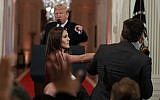 President Donald Trump watches as a White House aide takes away a microphone from CNN journalist Jim Acosta during a news conference in the East Room of the White House, Wednesday, November 7, 2018, in Washington. (AP/Evan Vucci)