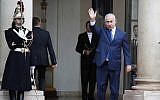 Prime Minister Benjamin Netanyahu waves, as he arrives at the Elysee Palace in Paris for a lunch after participating in a World War I commemoration ceremony, on November 11, 2018. (AP Photo/Christophe Ena)