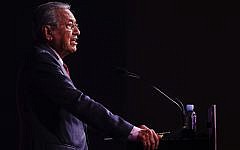 Malaysian Prime Minister Mahathir Mohamad delivers his keynote address during the ASEAN Business and Investment Summit on the sidelines of the 33rd ASEAN summit in Singapore, on November 13, 2018. (AP Photo/Yong Teck Lim)