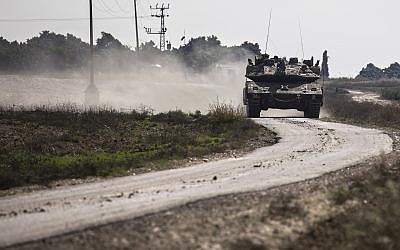 An Israeli tank drives near the Israel Gaza border, Tuesday, Nov. 13, 2018. (AP/Tsafrir Abayov)