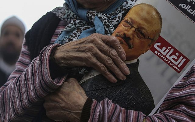A woman holds a poster during the funeral prayers in absentia for Saudi writer Jamal Khashoggi, who was killed last month in the Saudi Arabia consulate, in Istanbul, November 16, 2018. (AP/Emrah Gurel) A woman holds a poster during the funeral prayers in absentia for Saudi writer Jamal Khashoggi, who was killed last month in the Saudi Arabia consulate, in Istanbul, November 16, 2018. (AP/Emrah Gurel)