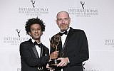 Actor Yossi Vasa, left and director Shai Ben Atar pose in the press room with their award for best comedy, 'Nevsu,' during the 46th International Emmy Awards gala in New York City, November 19, 2018. (Amy Sussman/ Invision/ AP)