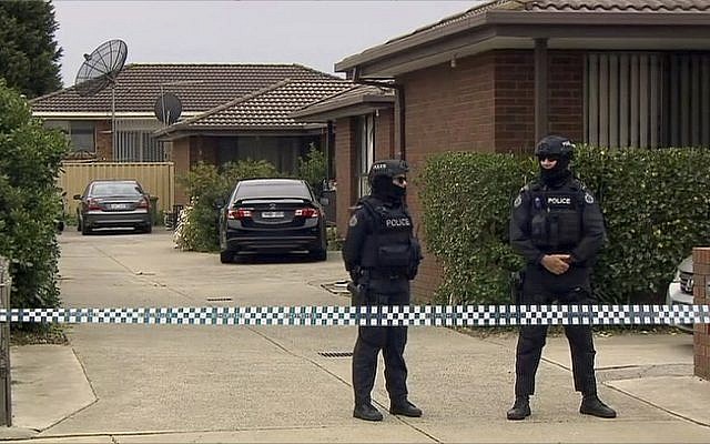 Illustrative: In this image made from video, police stand guard outside a raided property connected to a foiled terror attack, Tuesday, Nov. 20, 2018, in Melbourne, Australia. Three men inspired by the Islamic State group were charged with planning a mass-casualty attack in Australia's second-largest city Melbourne. (ABC via AP) Illustrative: In this image made from video, police stand guard outside a raided property connected to a foiled terror attack, Tuesday, Nov. 20, 2018, in Melbourne, Australia. Three men inspired by the Islamic State group were charged with planning a mass-casualty attack in Australia's second-largest city Melbourne. (ABC via AP)