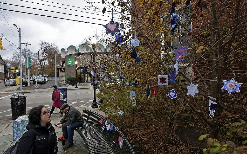 In this Tuesday, Nov. 20, 2018 photo, Stars of David hang from bushes outside the post office in the Squirrel Hill neighborhood of Pittsburgh. (AP/Gene J. Puskar) In this Tuesday, Nov. 20, 2018 photo, Stars of David hang from bushes outside the post office in the Squirrel Hill neighborhood of Pittsburgh. (AP/Gene J. Puskar)