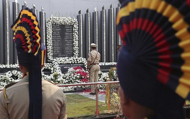 Indian police officers pay tribute to the victims of the Mumbai terror attacks at a memorial in Mumbai, India on Nov. 26, 2018. (AP Photo/Rafiq Maqbool) Indian police officers pay tribute to the victims of the Mumbai terror attacks at a memorial in Mumbai, India on Nov. 26, 2018. (AP Photo/Rafiq Maqbool)