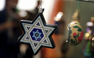 Christmas tree decorations are displayed at the German Historic Museum in Berlin, Germany, Friday, November 30, 2018 during the exhibition 'Angel, Swastika, Dome of the Rock. Christmas Tree Decorations from the 19th Century until Today.' (AP Photo/Michael Sohn)