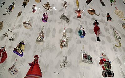 Christmas tree decorations are displayed at the German Historic Museum in Berlin, Germany, Friday, Nov. 30, 2018 during the exhibition 'Angel, Swastika, Dome of the Rock. Christmas Tree Decorations from the 19th Century until Today'. (AP Photo/Michael Sohn)