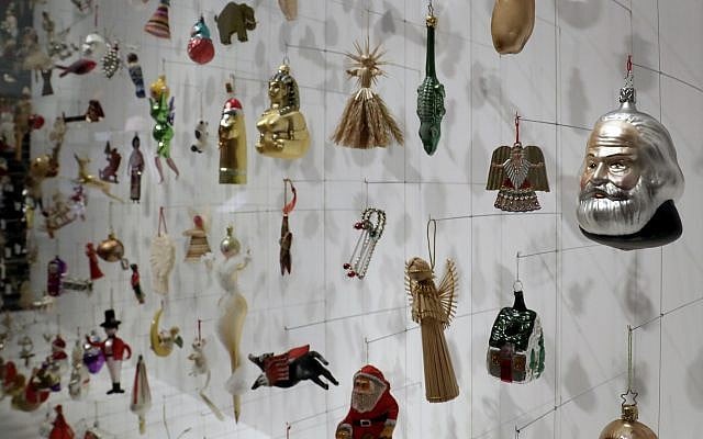 Christmas tree decorations are displayed at the German Historic Museum in Berlin, Germany, Friday, Nov. 30, 2018 during the exhibition 'Angel, Swastika, Dome of the Rock. Christmas Tree Decorations from the 19th Century until Today'. (AP Photo/Michael Sohn)