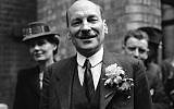 Clemet Attlee smiles at the cheering throngs which gathered at Transport House, in London on July 26, 1945, to hear Labour’s great victory at the polls. Violet Attlee stands beside her husband,left. (AP Photo)