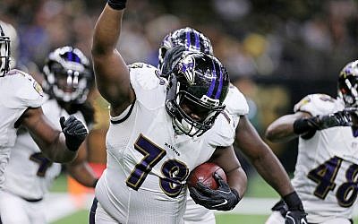 Baltimore Ravens defensive tackle Michael Pierce (78) celebrates after recovering a fumble in the end zone by New Orleans Saints quarterback Drew Brees for a touchdown in the first half of a pre-season NFL football game in New Orleans, September 1, 2016. (AP/Butch Dill)