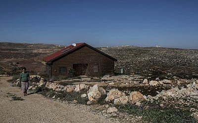 Inbal Zeev walks, on January 17, 2016, by her guest house advertised on Airbnb in the Nofei Prat settlement in the West Bank. (AP/Tsafrir Abayov)